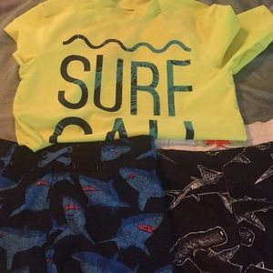 Combo of boy swim shorts and spf rash guard .